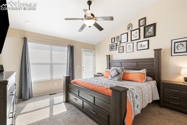 bedroom featuring light carpet, visible vents, baseboards, lofted ceiling, and ceiling fan