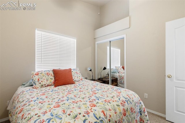 carpeted bedroom featuring a closet