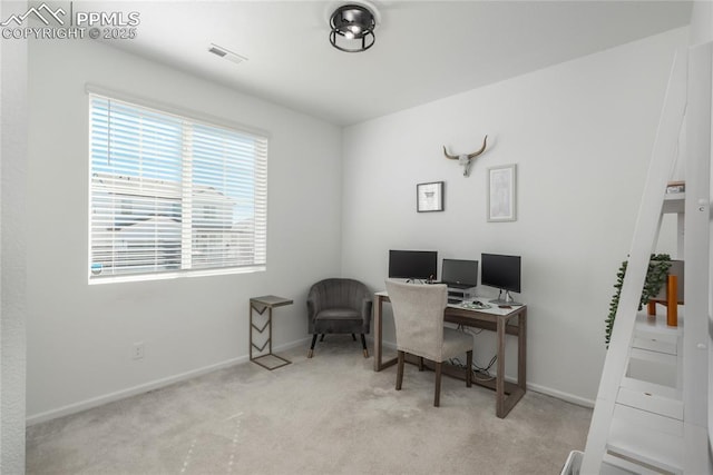 carpeted home office with baseboards and visible vents