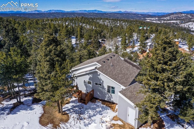 bird's eye view with a forest view and a mountain view