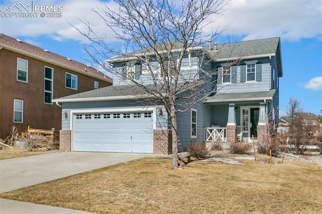 view of front of house featuring driveway, a porch, a front yard, and brick siding