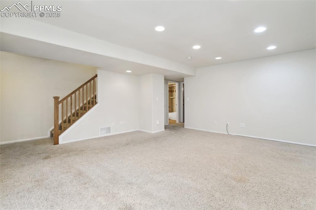 unfurnished room featuring recessed lighting, carpet flooring, visible vents, baseboards, and stairs