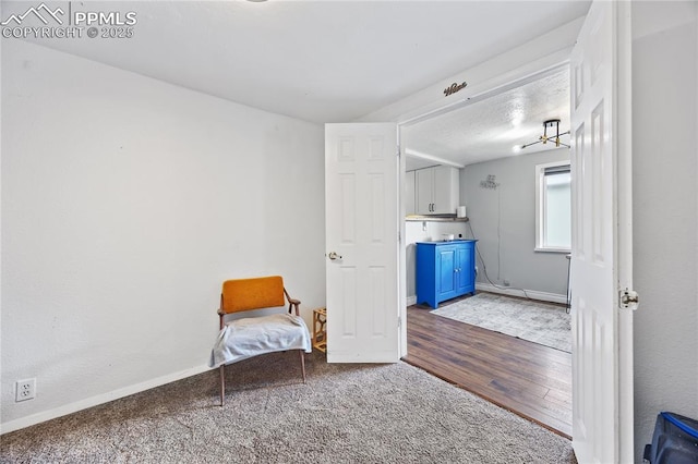 unfurnished room featuring baseboards and wood finished floors