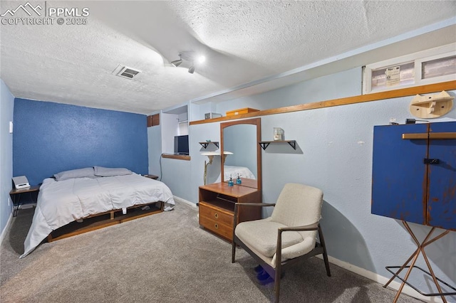 bedroom with a textured ceiling, a textured wall, visible vents, and baseboards