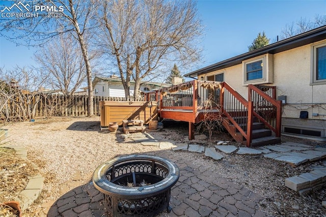 view of yard with a patio area, fence, and a wooden deck