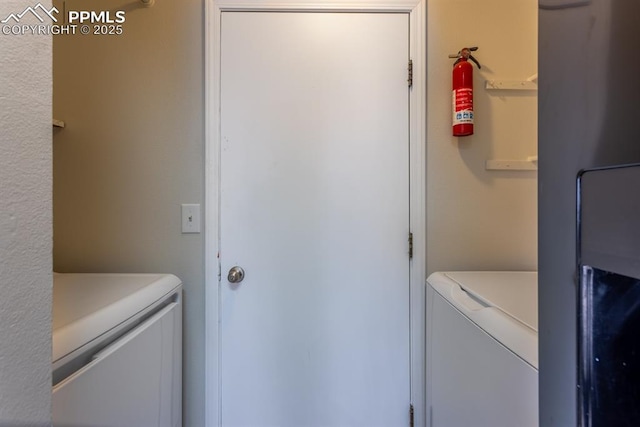 washroom featuring laundry area and independent washer and dryer