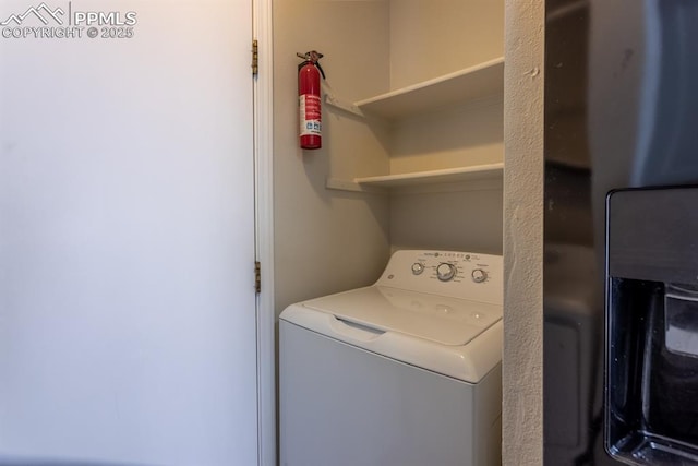 laundry room with washer / dryer and laundry area