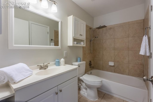 full bathroom featuring  shower combination, vanity, toilet, and tile patterned floors