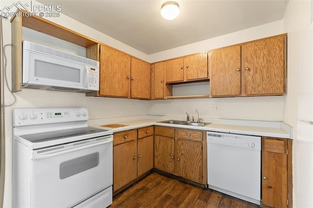 kitchen featuring white appliances, dark wood finished floors, light countertops, open shelves, and a sink