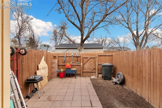 4054 Charleston Dr, Colorado Springs, CO 80916 - view of patio / terrace with a fenced backyard, a gate, and grilling area