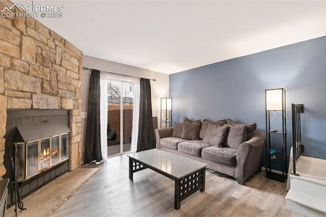 4054 Charleston Dr, Colorado Springs, CO 80916 - living room featuring a fireplace and wood finished floors