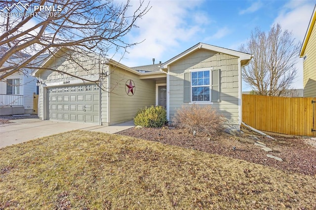 ranch-style house with concrete driveway, a garage, and fence