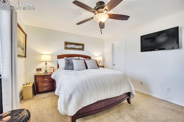 bedroom with light carpet, ceiling fan, and baseboards