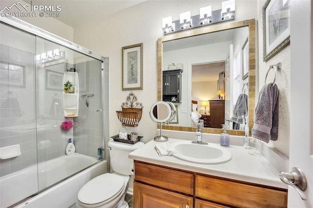 bathroom featuring ensuite bath, toilet, vanity, and enclosed tub / shower combo