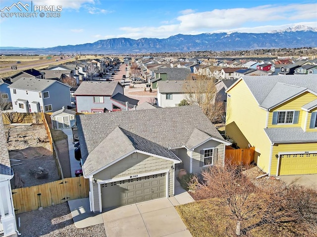 drone / aerial view featuring a mountain view and a residential view