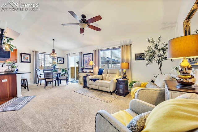 living room with a ceiling fan, light colored carpet, and high vaulted ceiling