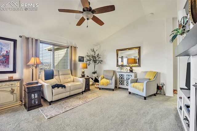 carpeted living room featuring ceiling fan and lofted ceiling