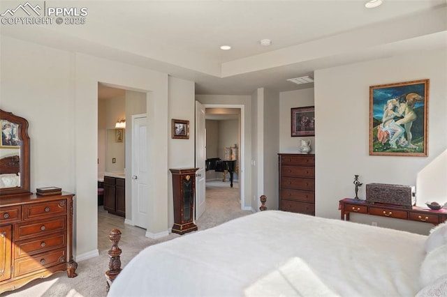 bedroom with baseboards, visible vents, ensuite bath, recessed lighting, and light carpet