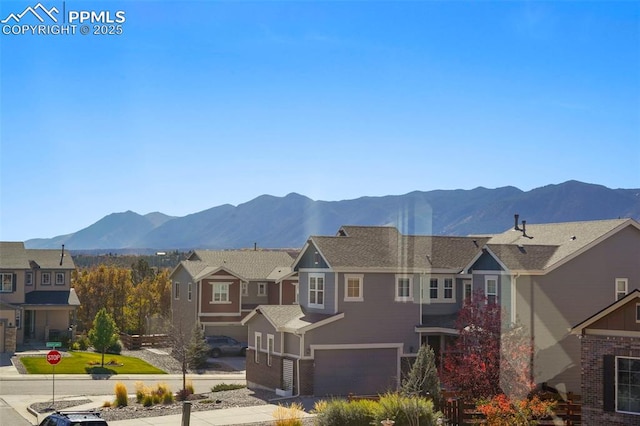 property view of mountains featuring a residential view