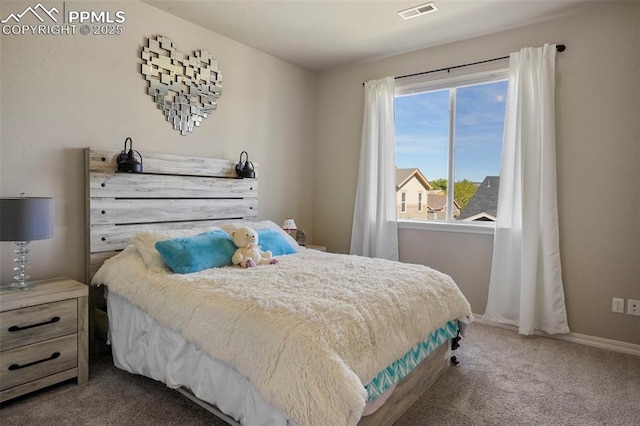 carpeted bedroom with baseboards and visible vents