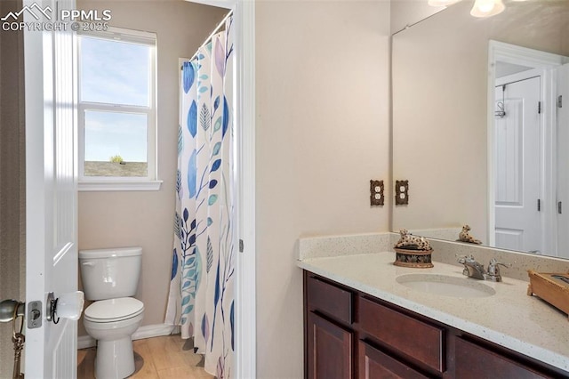 bathroom featuring toilet and vanity