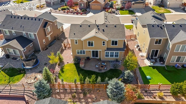 birds eye view of property with a residential view