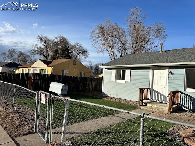 exterior space featuring fence private yard and a gate