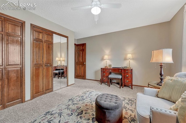 interior space with ceiling fan, baseboards, and a textured ceiling