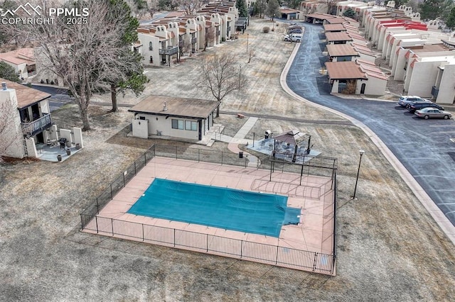 view of swimming pool featuring a fenced in pool and fence