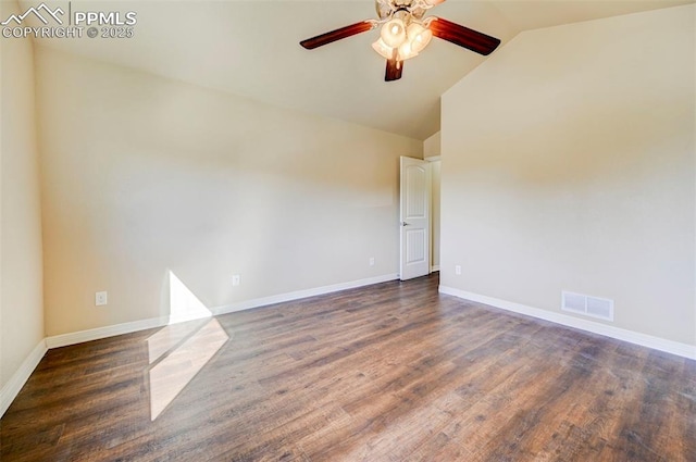 empty room with vaulted ceiling, a ceiling fan, wood finished floors, baseboards, and visible vents