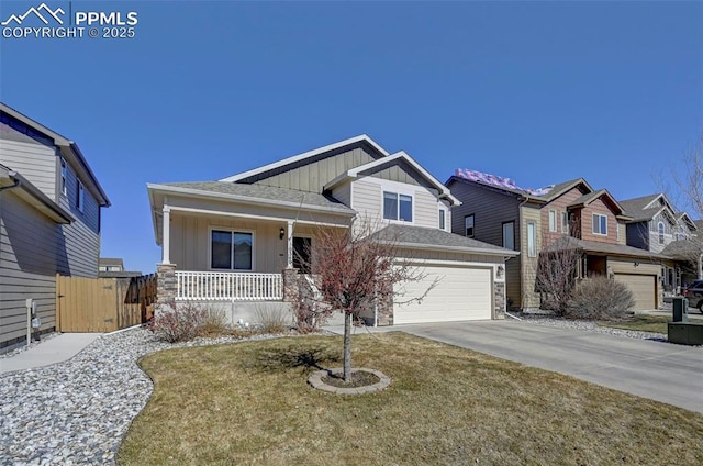 craftsman inspired home featuring roof with shingles, concrete driveway, fence, board and batten siding, and a porch
