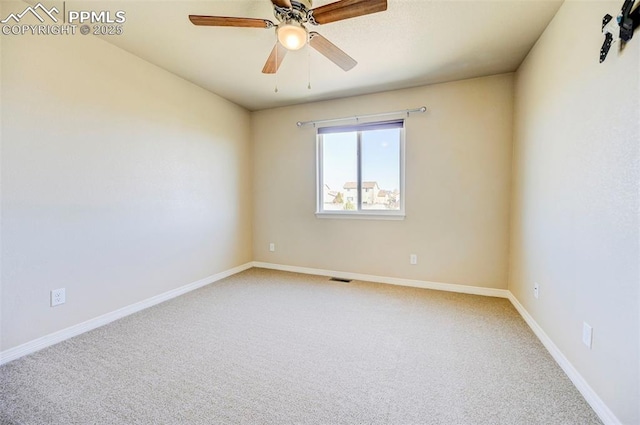 unfurnished room with a ceiling fan, baseboards, light colored carpet, and visible vents
