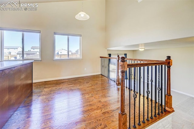 interior space with baseboards and wood finished floors