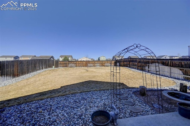 view of yard with a fenced backyard