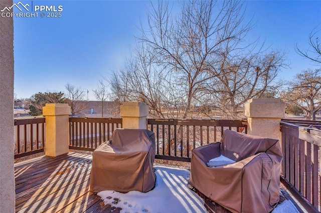 wooden terrace with area for grilling