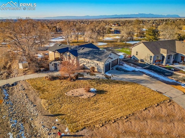 birds eye view of property with a mountain view