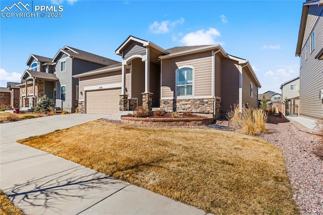 craftsman-style house with a garage, stone siding, concrete driveway, a residential view, and a front lawn