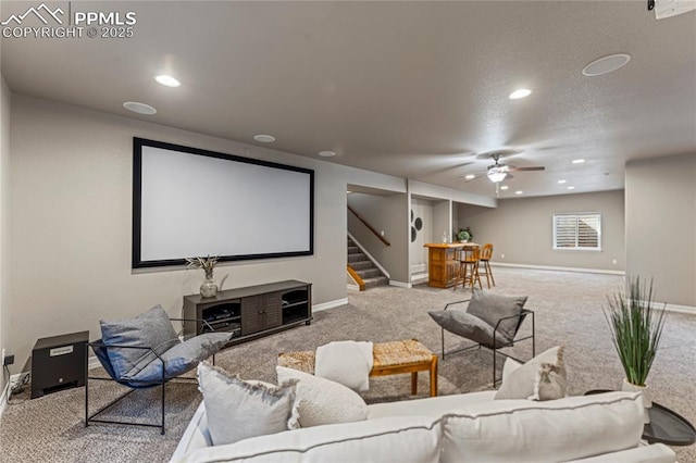 cinema with a textured ceiling, recessed lighting, a ceiling fan, baseboards, and carpet