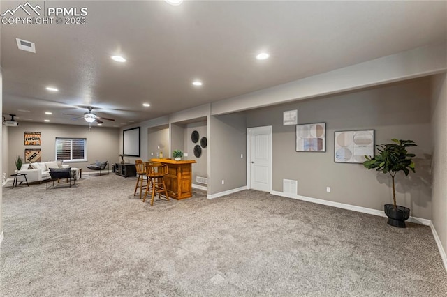 interior space featuring a dry bar, carpet, visible vents, and recessed lighting