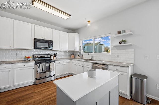 4925 Hawk Meadow Dr, Colorado Springs, CO 80916 - kitchen with decorative backsplash, appliances with stainless steel finishes, dark wood-type flooring, white cabinetry, and a sink