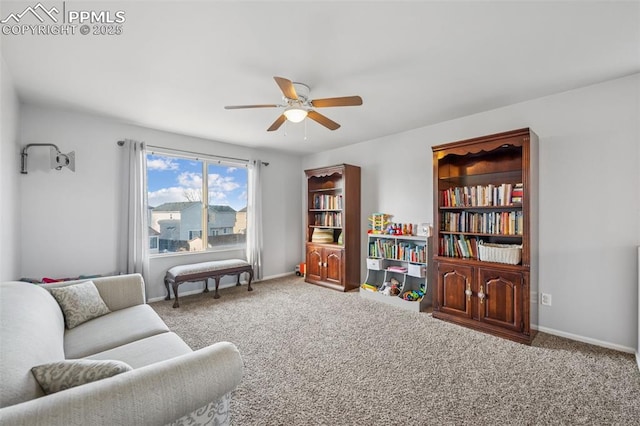 4925 Hawk Meadow Dr, Colorado Springs, CO 80916 - living area featuring carpet flooring, a ceiling fan, and baseboards