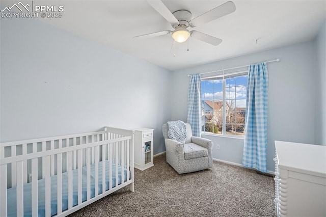 4925 Hawk Meadow Dr, Colorado Springs, CO 80916 - bedroom featuring a ceiling fan, carpet, a crib, and baseboards