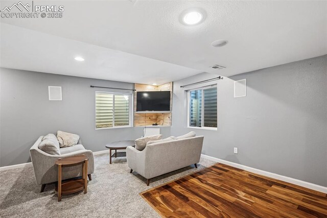 4925 Hawk Meadow Dr, Colorado Springs, CO 80916 - living area with carpet, baseboards, visible vents, and recessed lighting
