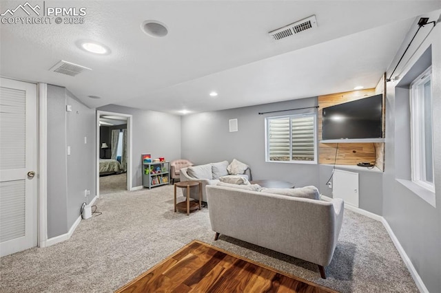 4925 Hawk Meadow Dr, Colorado Springs, CO 80916 - living room with carpet, visible vents, baseboards, and recessed lighting