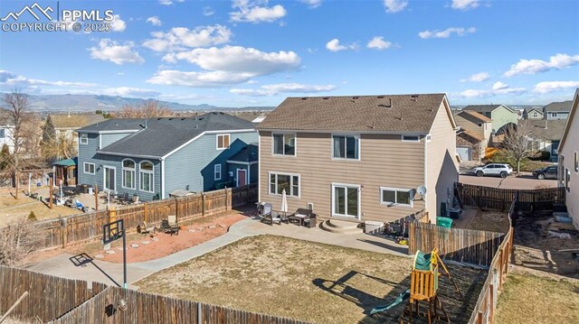 4925 Hawk Meadow Dr, Colorado Springs, CO 80916 - rear view of property with a patio, a fenced backyard, and a residential view
