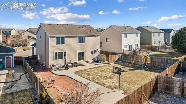 4925 Hawk Meadow Dr, Colorado Springs, CO 80916 - rear view of house featuring entry steps, a patio area, a fenced backyard, and a residential view
