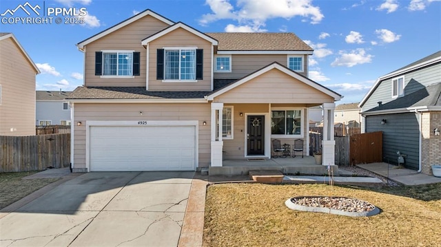 4925 Hawk Meadow Dr, Colorado Springs, CO 80916 - view of front of property with covered porch, a garage, fence, driveway, and roof with shingles