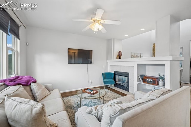 4925 Hawk Meadow Dr, Colorado Springs, CO 80916 - living area with ceiling fan, a tile fireplace, recessed lighting, wood finished floors, and baseboards