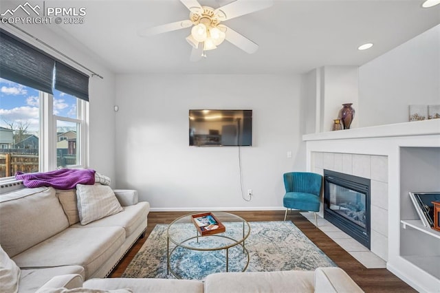 4925 Hawk Meadow Dr, Colorado Springs, CO 80916 - living area featuring a fireplace, recessed lighting, a ceiling fan, wood finished floors, and baseboards