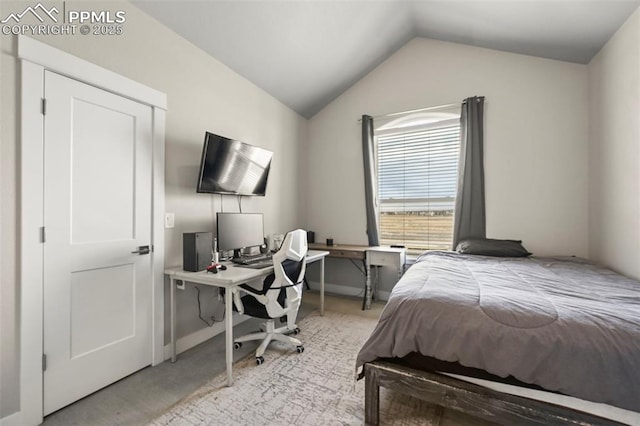 carpeted bedroom featuring baseboards and vaulted ceiling